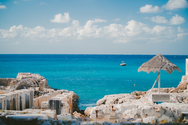 body of water with bright blue sky in cozumel, mexico